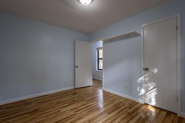 spare room with hardwood / wood-style flooring