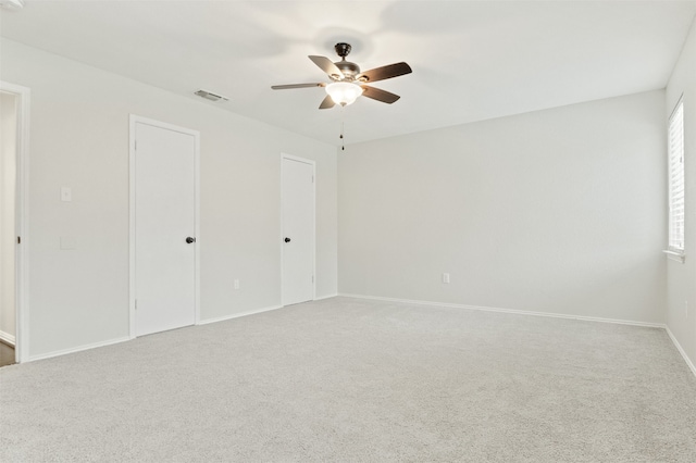 unfurnished bedroom featuring ceiling fan and carpet floors