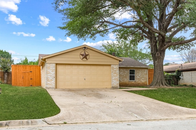 ranch-style house featuring a front yard and a garage