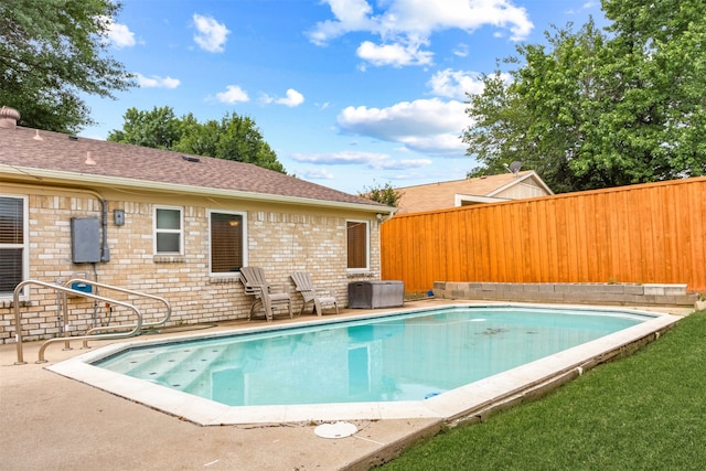 view of swimming pool with a patio