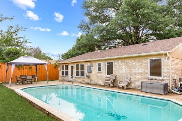 view of swimming pool featuring a gazebo