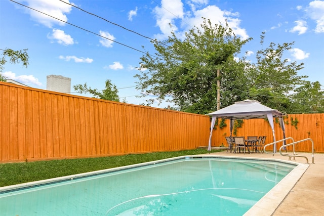 view of swimming pool featuring a gazebo