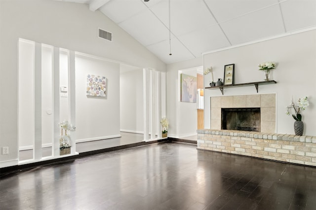 unfurnished living room featuring vaulted ceiling with beams and wood-type flooring