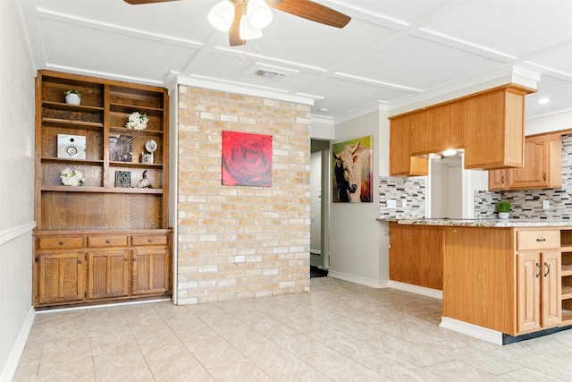 kitchen featuring tasteful backsplash, ceiling fan, ornamental molding, and coffered ceiling