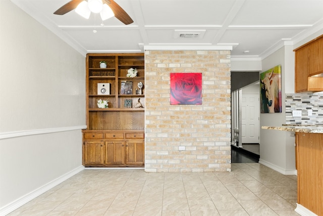 interior space with ornamental molding and ceiling fan