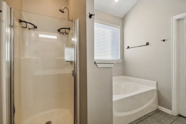 bathroom with tile patterned floors and independent shower and bath