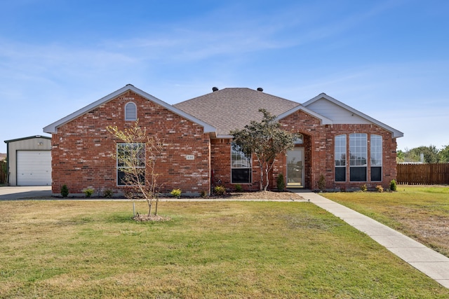 view of front facade with a garage and a front yard