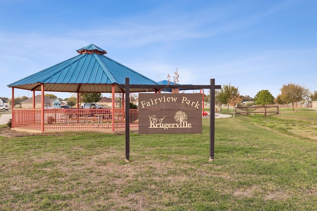 view of property's community with a gazebo and a lawn