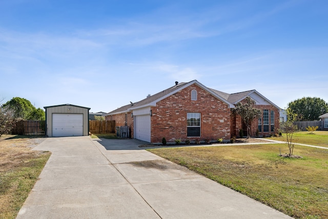 ranch-style home featuring a garage and a front yard