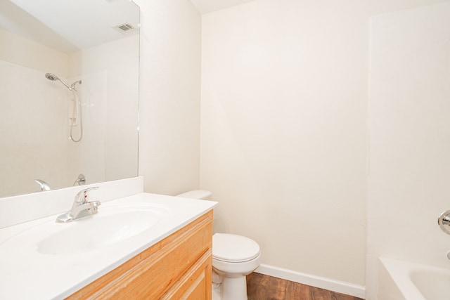 full bathroom with vanity, wood-type flooring, shower / bathtub combination, and toilet