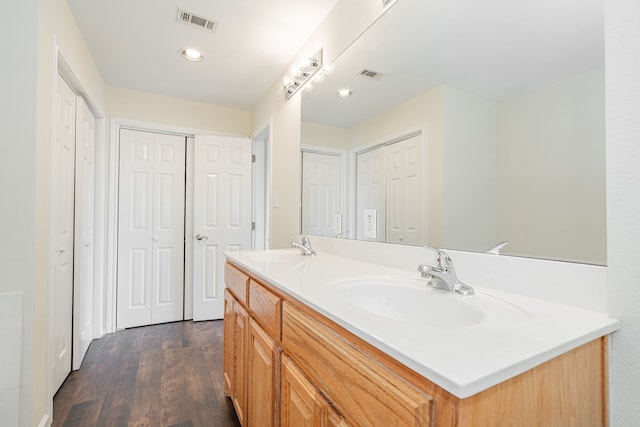 bathroom featuring vanity and wood-type flooring