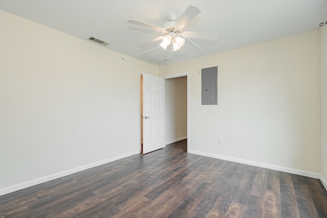 unfurnished room with dark hardwood / wood-style flooring, electric panel, and ceiling fan