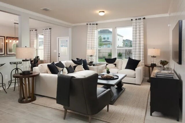 living room featuring crown molding and a notable chandelier