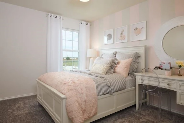 bedroom featuring dark colored carpet