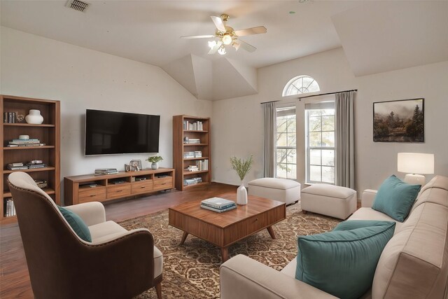 living room featuring dark hardwood / wood-style floors, ceiling fan, and lofted ceiling