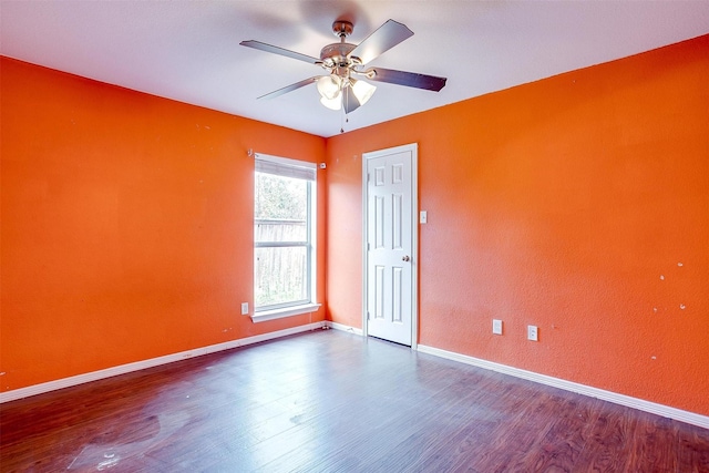 empty room featuring hardwood / wood-style flooring and ceiling fan