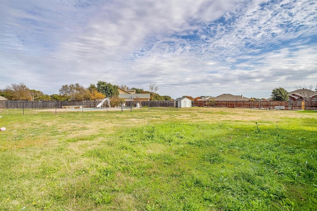 view of yard with a shed