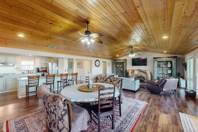 dining area featuring vaulted ceiling, wood ceiling, and hardwood / wood-style floors