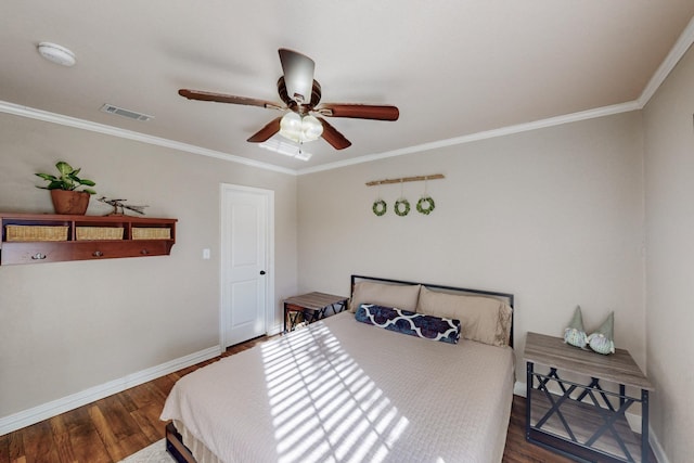 bedroom featuring ceiling fan, dark hardwood / wood-style flooring, and ornamental molding