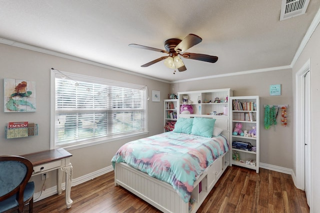 bedroom with ceiling fan, dark hardwood / wood-style flooring, and ornamental molding