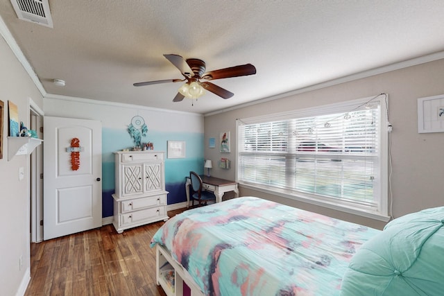 bedroom featuring ceiling fan, dark hardwood / wood-style floors, ornamental molding, and a textured ceiling