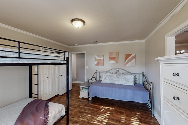 bedroom featuring dark hardwood / wood-style flooring and crown molding