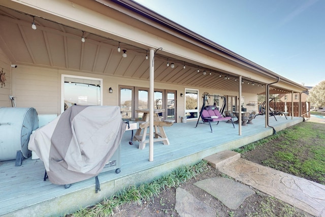 wooden deck featuring grilling area