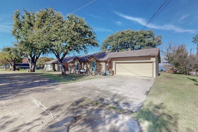 ranch-style home featuring a front yard and a garage