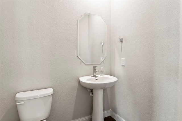 bathroom with sink and toilet