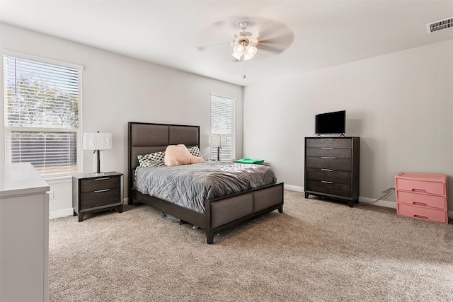 carpeted bedroom with ceiling fan