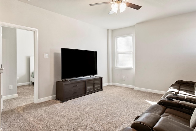 carpeted living room featuring ceiling fan