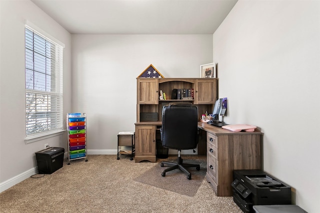 home office featuring light carpet and a healthy amount of sunlight