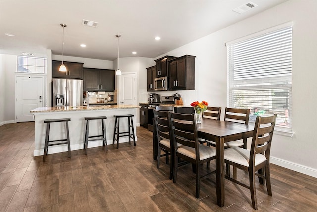 dining room featuring dark hardwood / wood-style floors and sink