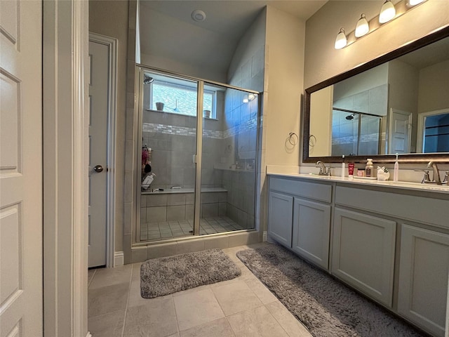 bathroom featuring tile patterned floors, vanity, and an enclosed shower