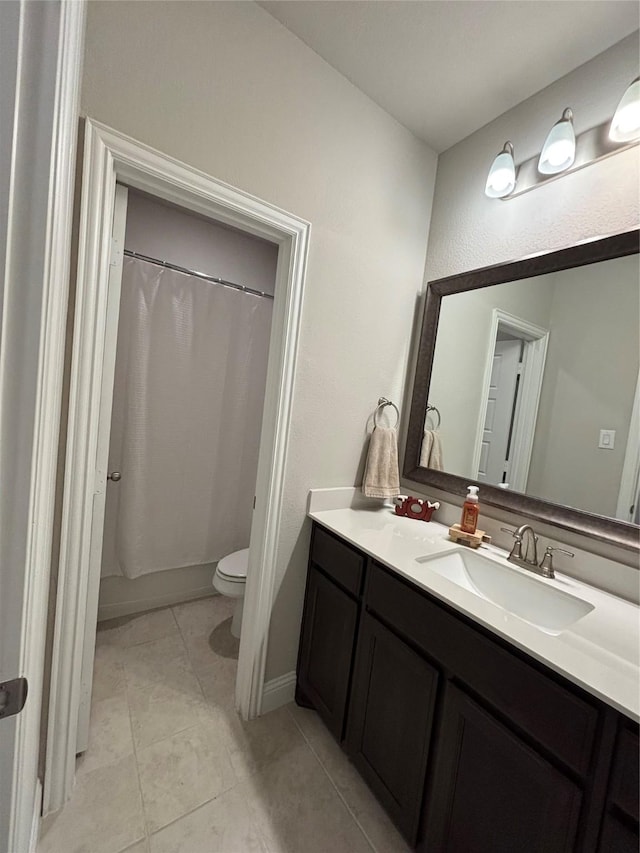 full bathroom with tile patterned floors, vanity, shower / tub combo, and toilet