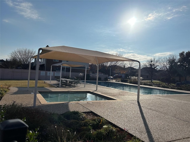 view of swimming pool featuring a patio area