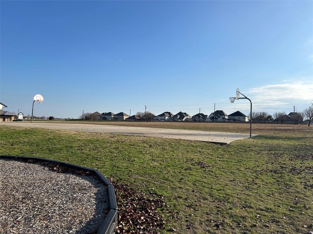 view of yard with basketball court