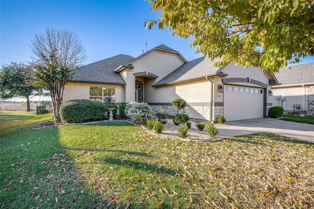 view of front facade with a front lawn and a garage