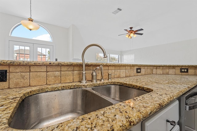 kitchen featuring sink, a wealth of natural light, ceiling fan, and decorative light fixtures