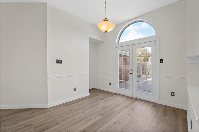 interior space featuring french doors and light hardwood / wood-style flooring