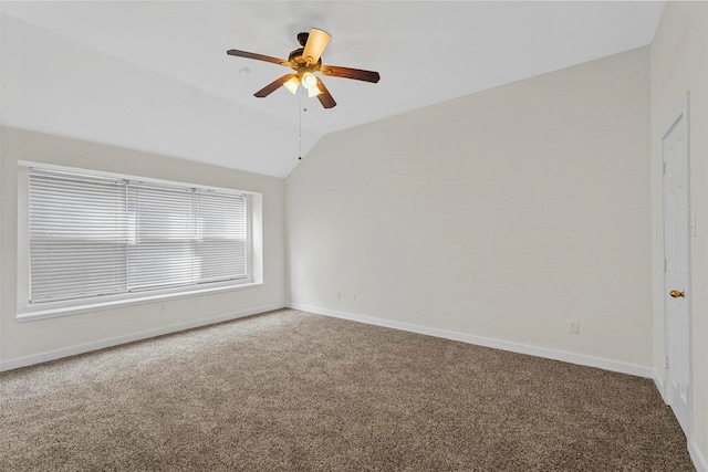 carpeted empty room featuring lofted ceiling and ceiling fan