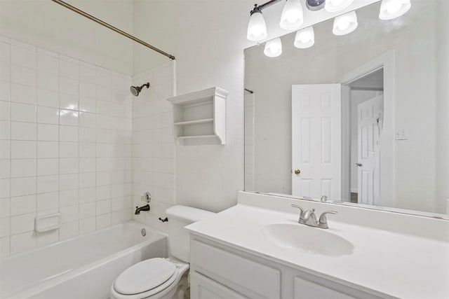 full bathroom with vanity, toilet, and tiled shower / bath combo