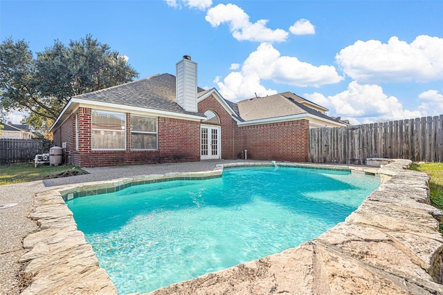 view of pool featuring french doors