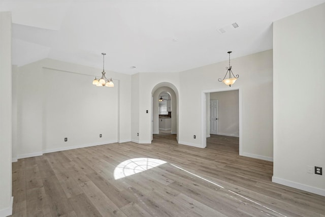 empty room with light hardwood / wood-style flooring