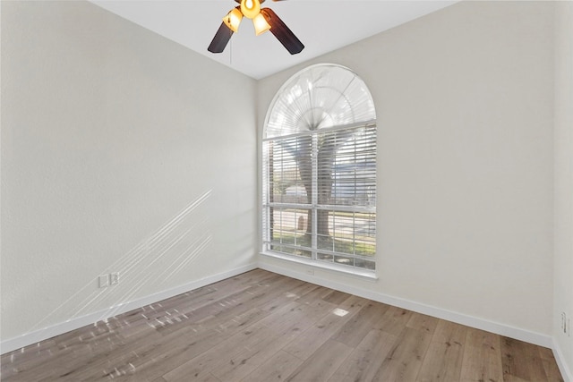 unfurnished room with hardwood / wood-style flooring and ceiling fan