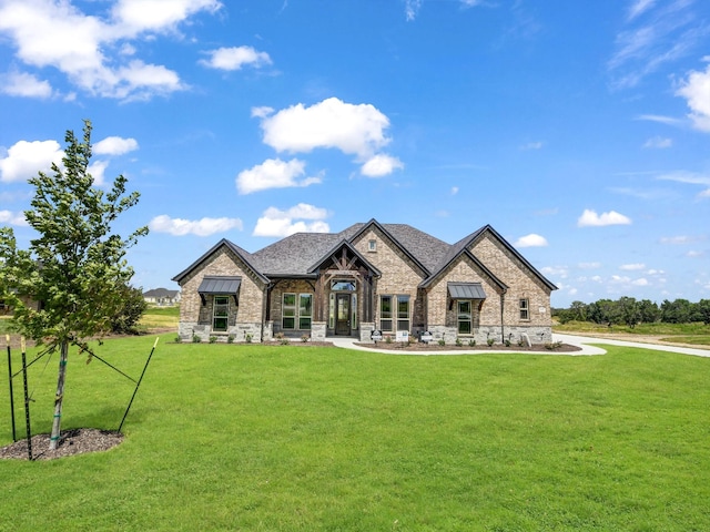 view of front of home with a front yard