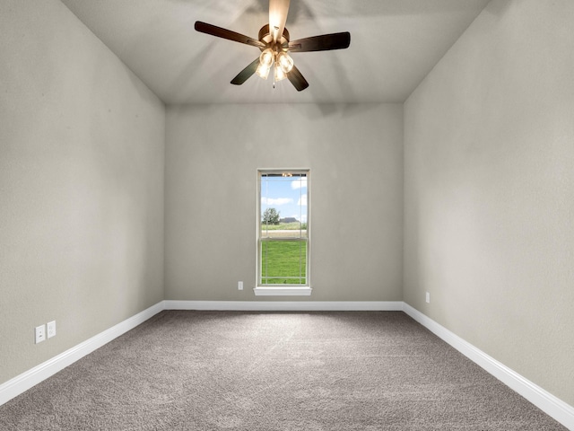 unfurnished room featuring ceiling fan and carpet floors