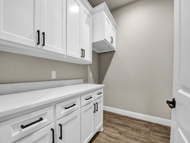 washroom with dark hardwood / wood-style flooring