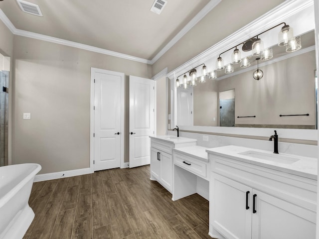 bathroom featuring hardwood / wood-style floors, vanity, crown molding, and independent shower and bath