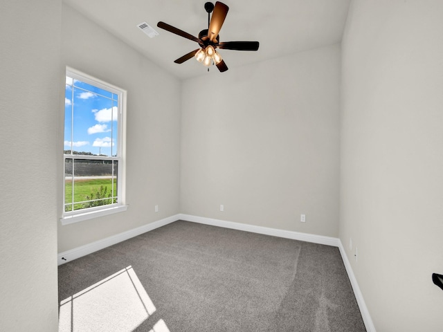 empty room featuring ceiling fan and carpet floors